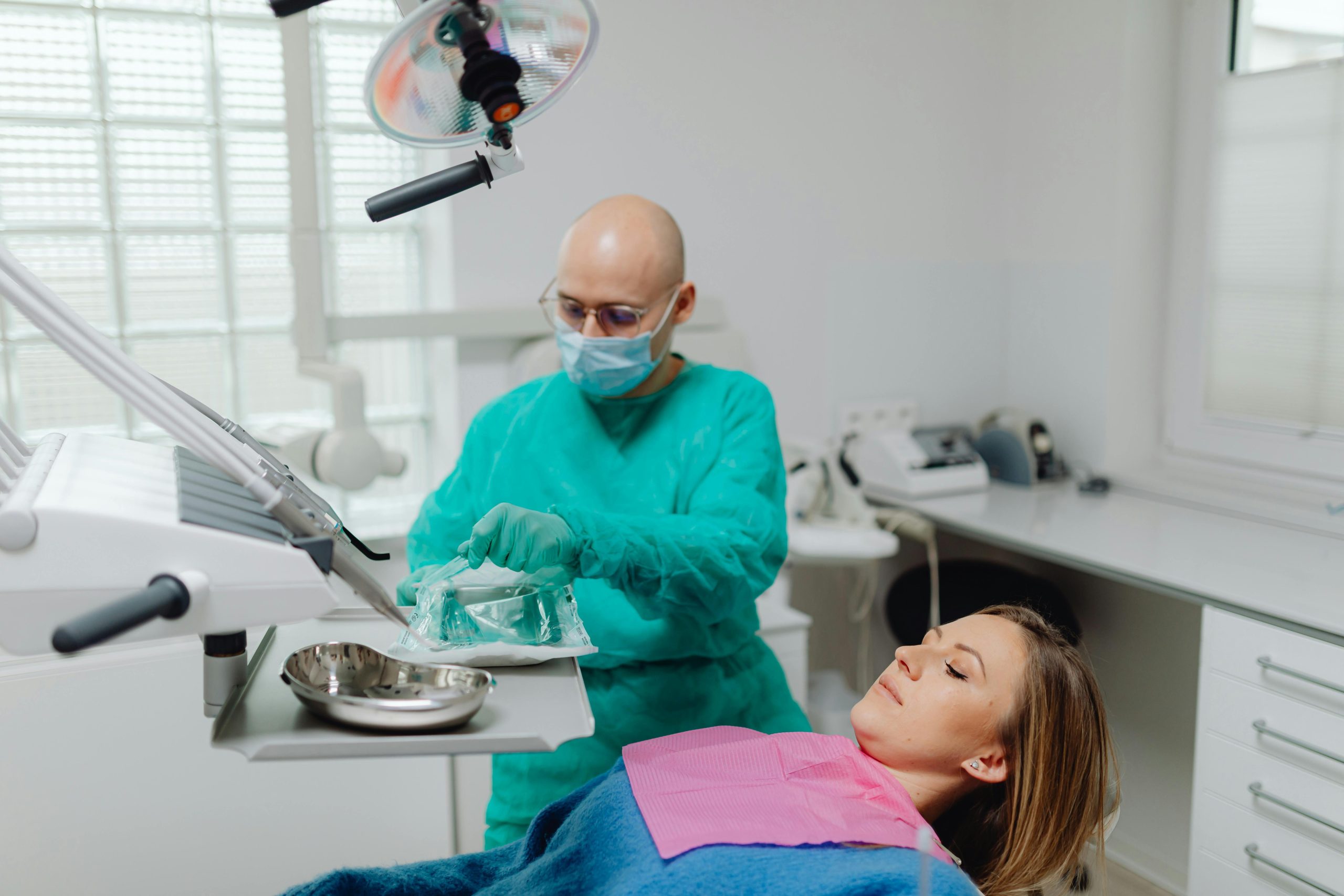 Dental-hygienist-examining-a-patient-during-a-routine-check-up-for-optimal-oral-health.